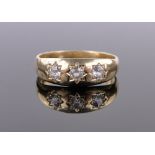 An 18ct gold 3 stone diamond set gypsy ring, size V, 6g.