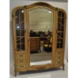 A continental walnut arch-top 3-section wardrobe,