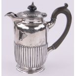 A silver hot water jug circa 1900, half fluted circular form, indistinct hallmarks, 11.5 oz.