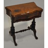 A Victorian burr walnut serpentine foldover games table,