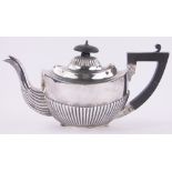 A silver bachelor's teapot of half fluted form, Birmingham 1912, 7.7 oz.