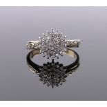 A 9ct gold diamond cluster ring, total diamond content approx. 0.5cts, setting height 10mm, size P.