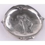 A WMF silver plated dish with relief embossed study of Dutch children, diameter 12cm.