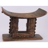 An African carved wood Ashanti stool, length 55cm.