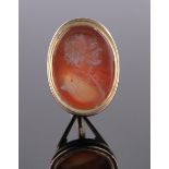 A 19th century unmarked gold fob seal with intaglio Cornelian portrait.