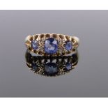 An Edwardian 18ct gold 7 stone sapphire and diamond ring, size J.