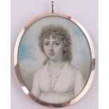 An early 19th century miniature watercolour on ivory portrait of a young woman, unsigned,