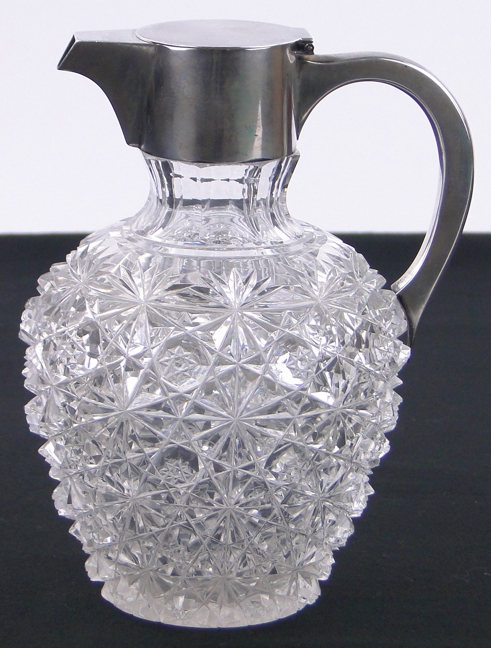 A Victorian cut-glass and silver mounted claret jug, hallmarks London 1888, height 20cm.