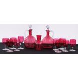 A quantity of Victorian Cranberry glass, including 2 similar claret jugs and stoppers,