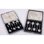 2 Cased sets of silver coffee spoons.