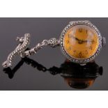 A silver and marcasite cased ball pendant watch, with amber coloured glass domed covers,