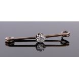 A 0.3ct diamond set bar brooch.