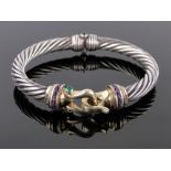 A silver and gold hinged bangle by David Yurman (California),