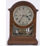 An oak cased dome top bracket clock circa 1920,