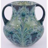 A large early 20th century Moorcroft Florian Ware 2-handled vase, tube-lined foliate design,