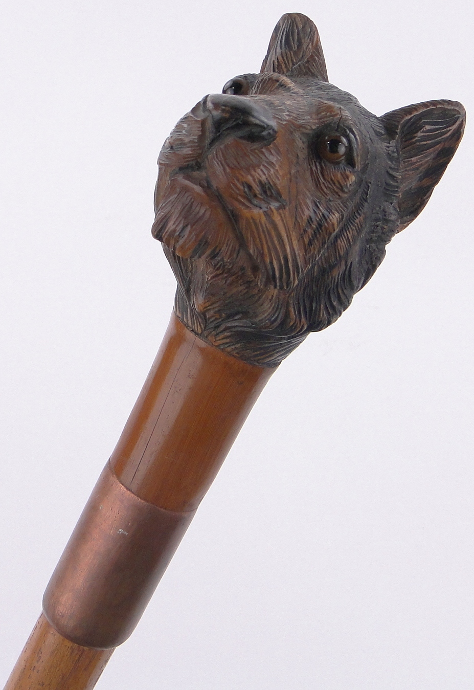 An unusual carved and painted wood tiger head design walking stick, with inset glass eyes.