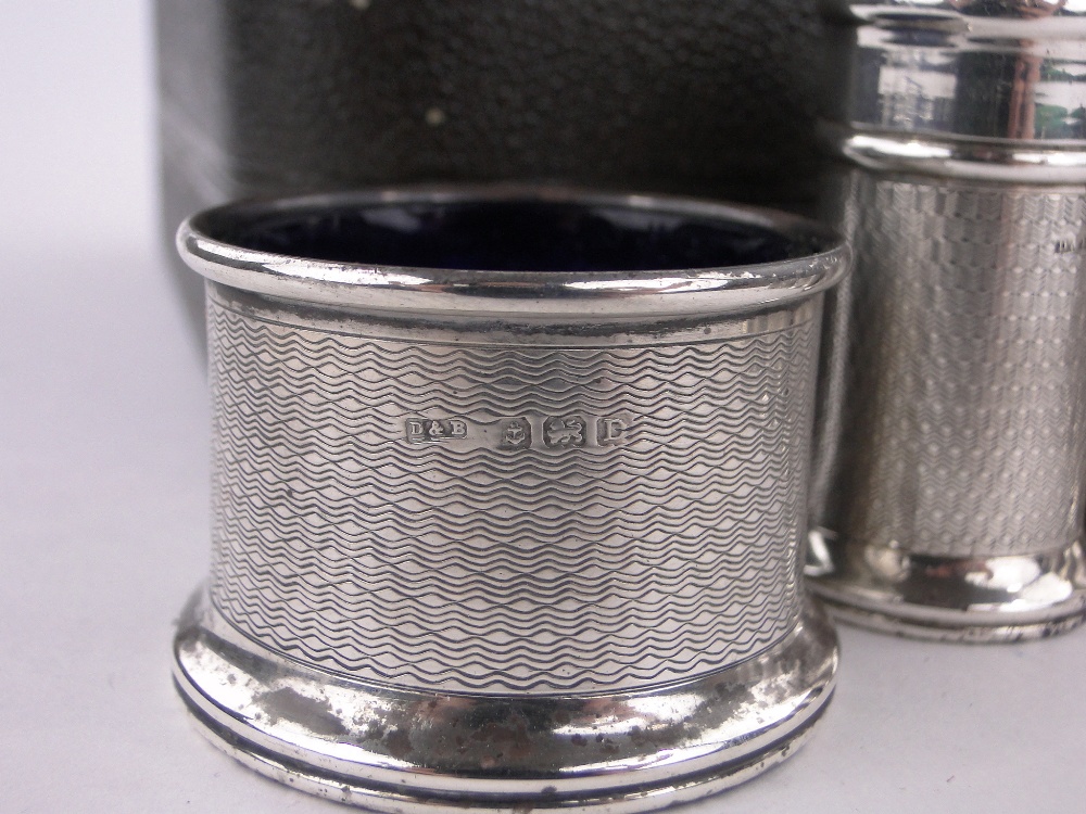 A 5-piece engine turned silver cruet set, with blue glass liners, Birmingham 1928. - Image 3 of 3