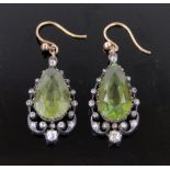 Pair of pear shaped peridot and diamond set open work drop earrings, circa 1920s,