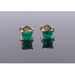 Pair of 9ct gold square-cut emerald set earstuds, length 5mm.