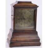 A 19th century walnut cased bracket clock, with engraved brass dial and fusee movement, height 42cm.