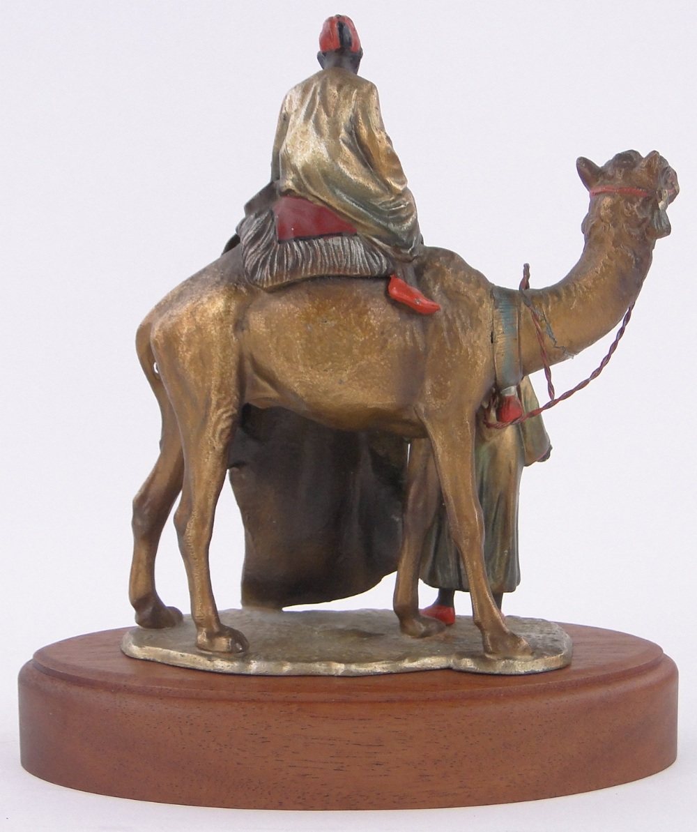 An Austrian painted spelter table lighter in the form of Arab carpet sellers and camel, - Image 2 of 3