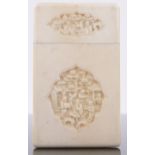 A 19th century Chinese ivory card case, with inset relief carved panels, 9.5cm x 5.5cm.