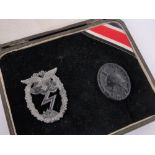 A German Third Reich Luftwaffe ground combat badge and wounded badge,