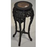 An Oriental hardwood jardiniere stand, with inset marble top, carved and pierced frieze, width 11",