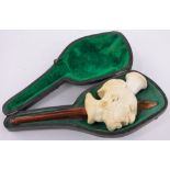 A rare Meerschaum and amber pipe in the form of a Native American with a spear through his head,
