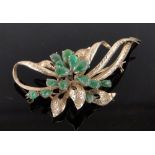 A 14ct gold and jade set brooch.