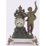 A French patinated spelter cased mantel clock surmounted by a figure of a boy,