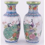 Pair of 20th century Chinese porcelain vases with peacock designs, height 46cm.
