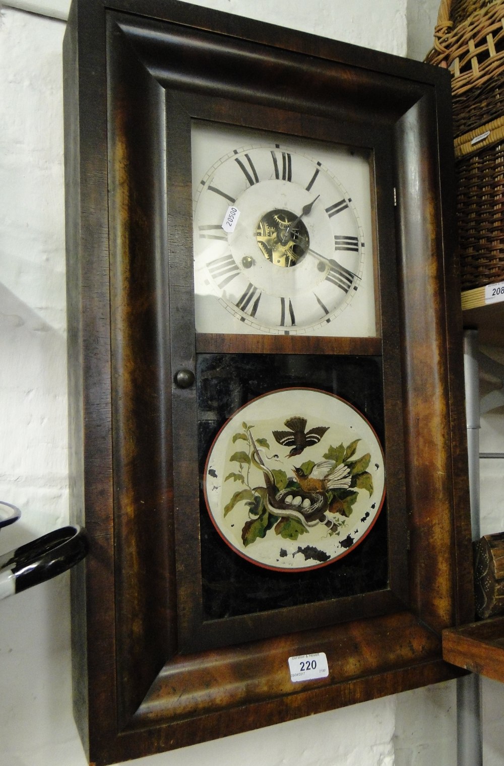 An American wall clock by Seth Thomas with bird & snake decorated panel