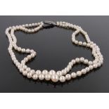 A double row cultured pearl necklace, with silver and marcasite clasp.