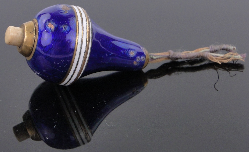 A blue and white banded enamel electric bell push, length 4.5cm.