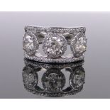 A large platinum 3 stone diamond cluster ring, modern round brilliant-cut stones,