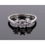 An 18ct white gold and platinum 3 stone diamond ring, setting width 11mm, size J.