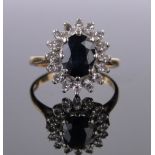 An 18ct gold sapphire and diamond cluster ring, setting height 15mm, size L, lacking one stone.