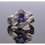 A 10ct gold square-cut tanzanite and baguette-cut diamond set ring, setting height 15mm, size M.