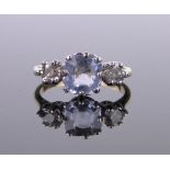 An 18ct Ceylon sapphire and diamond 3 stone ring, total diamond content approx. 0.