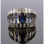 A 14ct gold sapphire and diamond set ring, band width 13mm, size N.