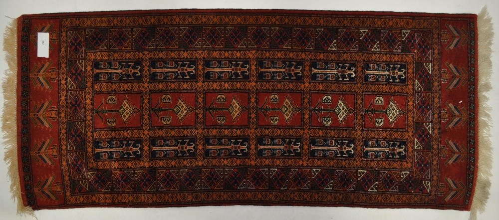 A red ground Tabriz style runner, 6'6" x 2'9".