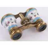 A pair of 19th century French gilt brass and enamelled opera glasses, with painted floral designs.