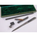 A Japanese white metal desk set, including paperknife and seal, cased.