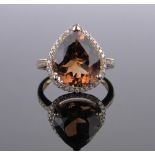 A 14ct gold pear shaped champagne topaz and diamond cluster ring, topaz approx. 7.