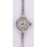 A lady's Vertex platinum and diamond set cocktail wristwatch, stainless steel strap,