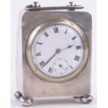 A miniature silver cased carriage clock, with enamelled dial and ball feet,