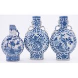 3 Chinese blue and white porcelain moon shaped flasks, largest height 26cm all damaged.