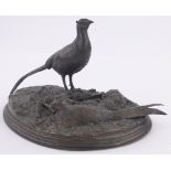 An early 20th century patinated bronze sculpture, pair of pheasant on naturalistic base,