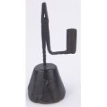 An Antique wrought-iron rush light holder on wooden stand, overall height 22.5cm.